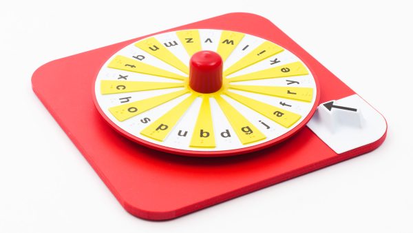 Overhead shot of the red Hop-a-Dot alphabet spinner. The interior of the spinner alternates between yellow and white. Each letter is printed in black.