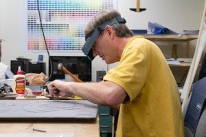 A model and pattern maker at work in the model shop