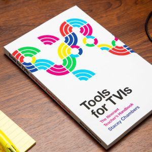 Printed copy of Tools for TVIs on a wooden desk.