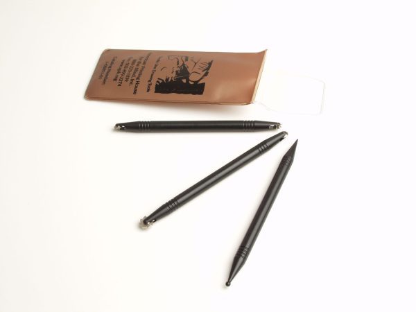 Three black line-drawing tools spread out next to the "Tactile Line Drawing Tools" pouch on a white background.