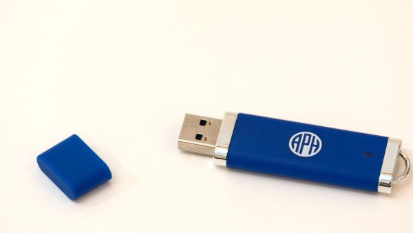 Blue USB thumb drive with the top cover removed. The thumb drive has a white APH logo in its center and sits on a white background.