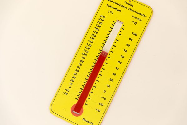 The Nemeth version of Tactile Demonstration Thermometer tilted 45 degrees on a white background. The thermometer is yellow with black labels and a red velvet temperature gauge that can be moved up and down using a clear tab that indicates the temperature. Fahrenheit is on the left, and Celsius is on the right. In the bottom right corner is a label that reads, "Nemeth."