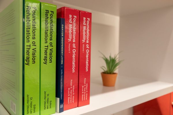 The two Foundations of O&M, 4th edition volumes on a white shelf with other Foundations titles.