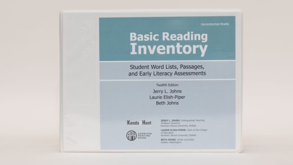 A three-ring Basic Reading Inventory binder labeled "Uncontracted Braille" standing on a white background. The blue cover says, "Basic Reading Inventory - Student Word Lists, Passages, and Early Literacy Assessments" and list the authors.