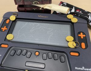 A close up of a Monarch screen shows an active eBraille file